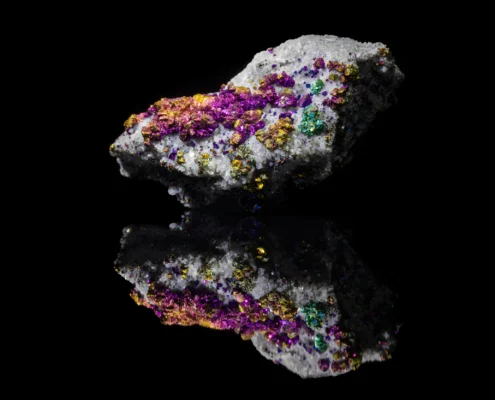 Chalcopyrite with Dolomite — Minerals Photography Chalcopyrite with dolomite mineral specimen — full view on black mirror background showing iridescent magenta gold and teal chalcopyrite crystals on white dolomite matrix, macro photography by Minerals Photography