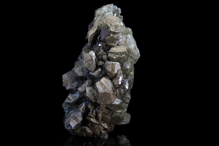 Tall pyrite and calcite specimen with golden pyrite inclusions on complex calcite crystal faces, macro photography by Minerals Photography