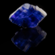 Deep blue-violet halite cubic crystal on mirror background with full reflection — mineral specimen photography by Minerals Photography
