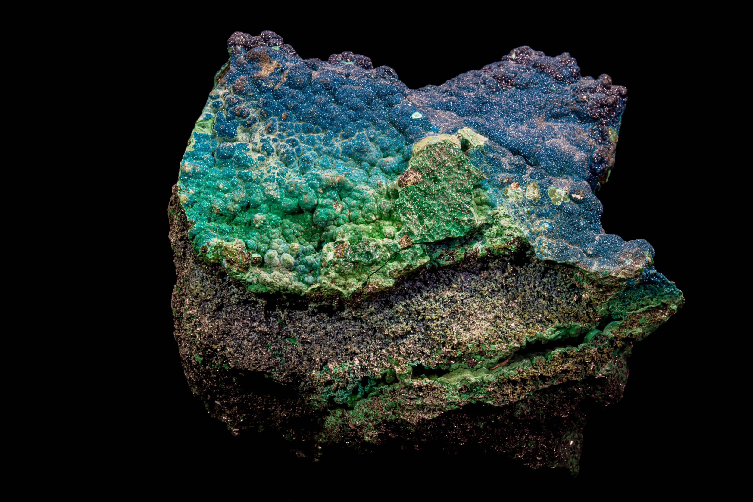 Green botryoidal cornetite mineral clusters on dark matrix, Congo.